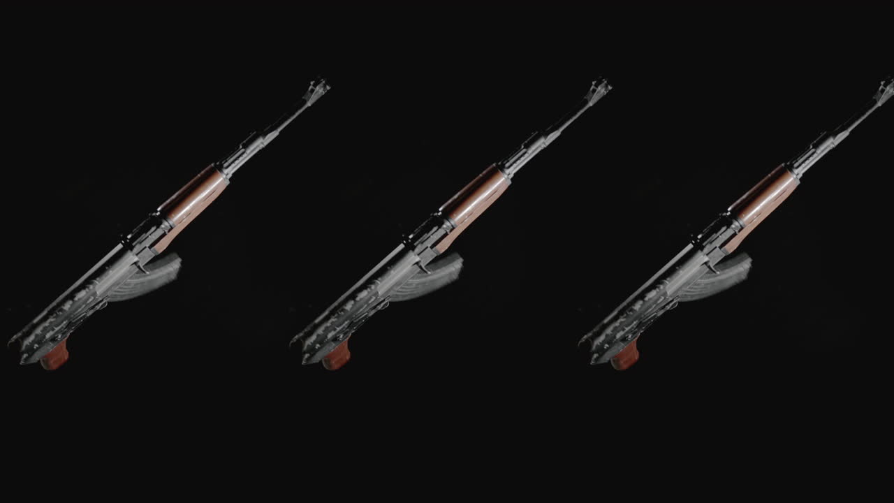 Machineguns on the dark background and in blinking rotate in slowmotion