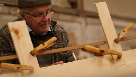 marking reference on wood boat using tape measure