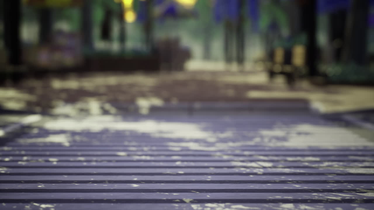 Slick wet pathway reflecting trees and lights during a rainy evening