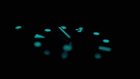 close up of a rotating watch on dark background