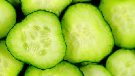 fresh green cucumber. spinning slowly in a circle. close up