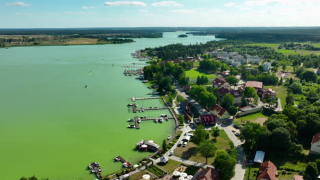 aerial view of a lakeside village with marina