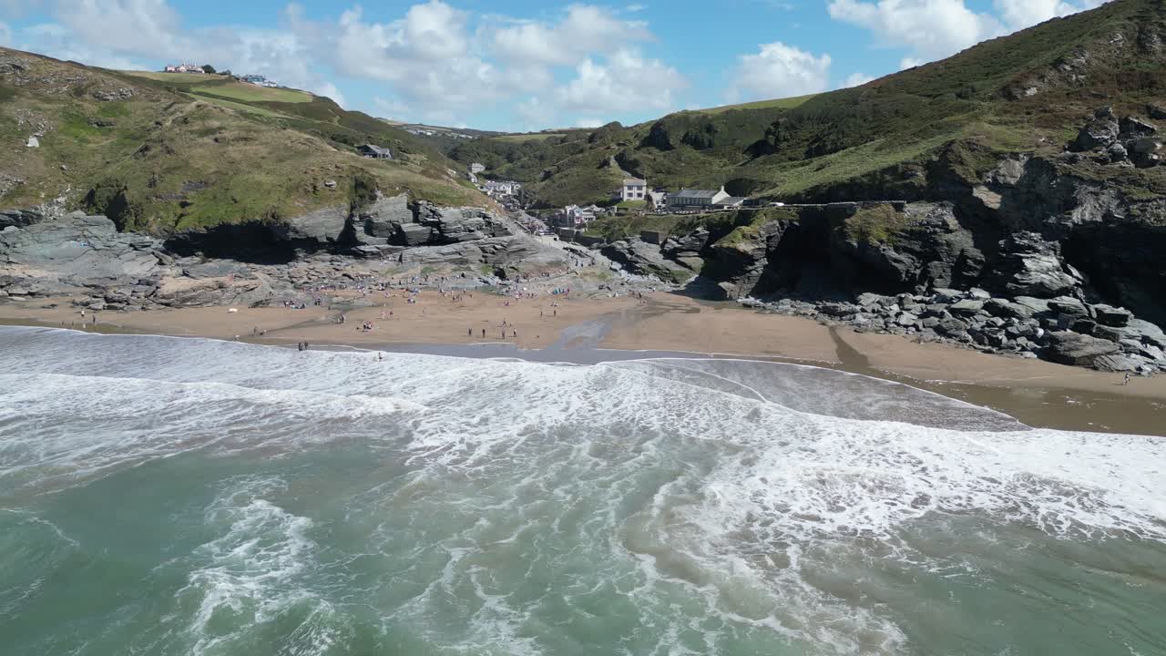 Coastal Beach Scene with Waves and Hills