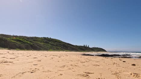 waves gently crashing on sandy beach