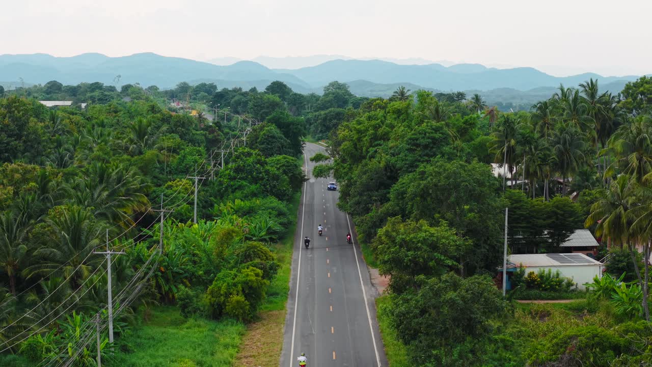 Country Road with Motorbike and Car Traffic