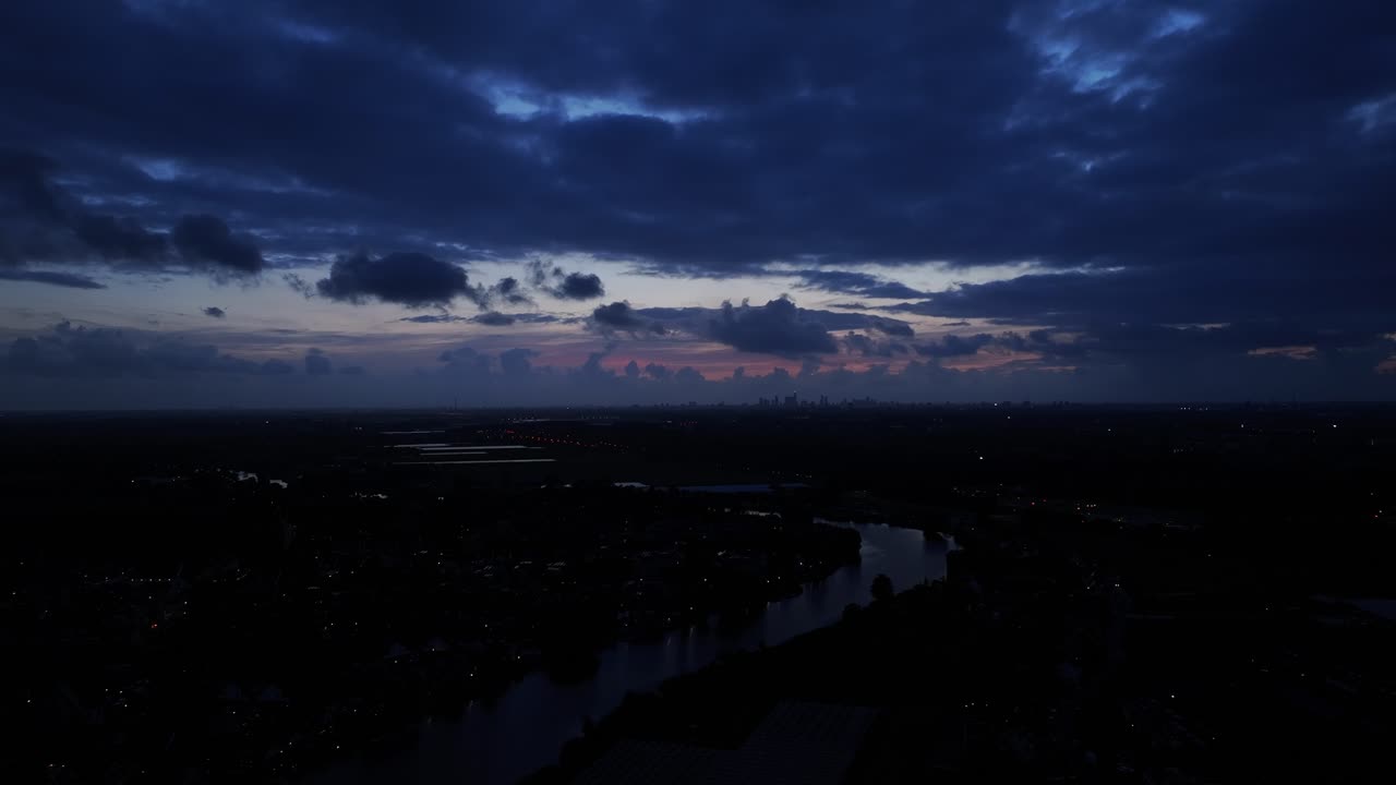 Dramatic and moody as sun sets over the city of Rotterdam, Netherlands