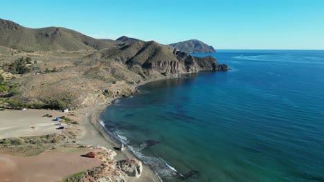 Cabo-de-Gata-coastline-in-Isleta-del-Moro,-Almeria,-Andalusia,-Spain---Aerial-4k