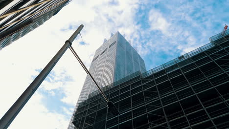 Modern-High-rise-Building-Structures-And-Streetlamp-In-Sydney,-Australia-Against-Bright-Blue-Sky-With-White-Clouds