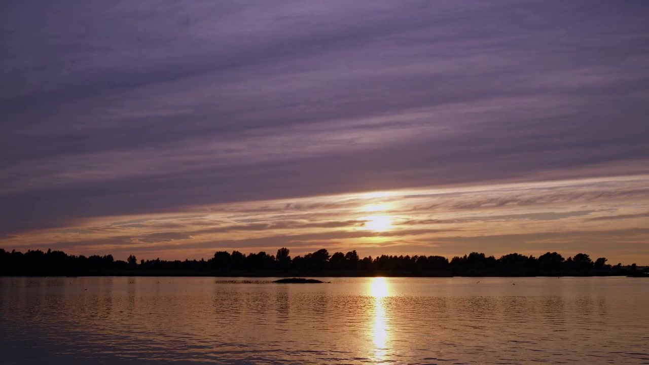 Time Lapse of Sunset Over a Calm Lake