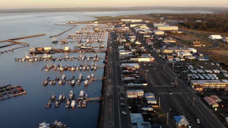 aerial sunset view of westport oregon, harbor with yacht and boat moored