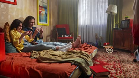 couple relaxing in a retro bedroom