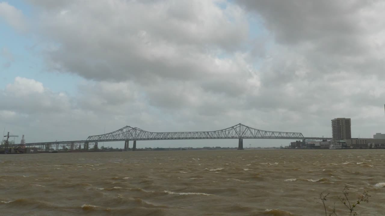 View of a Bridge over a River on a Cloudy Day
