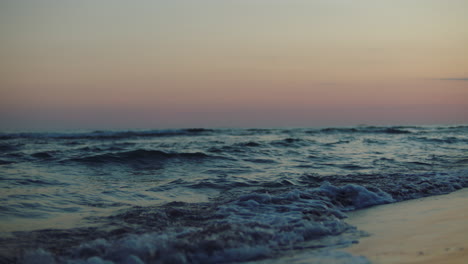 sunset over the ocean waves at the beach