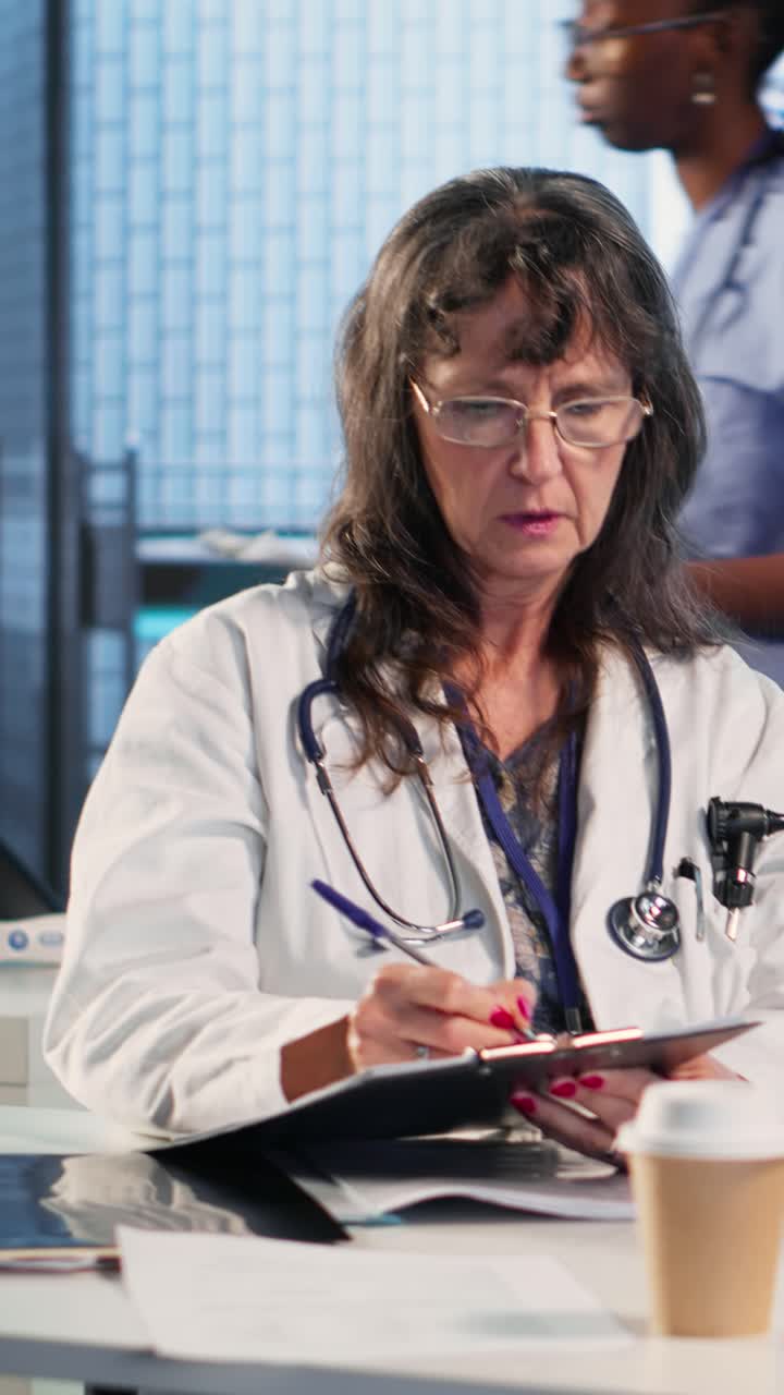 Vertical Video Female doctor providing expert advice to cure a migraine during checkup