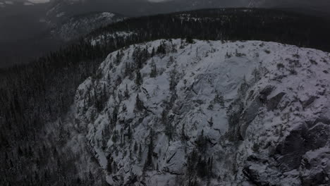 Rock-Massif-Mountains-Covered-With-Snow-On-Winter-In-Lac-a-L'Empeche,-Quebec-Canada