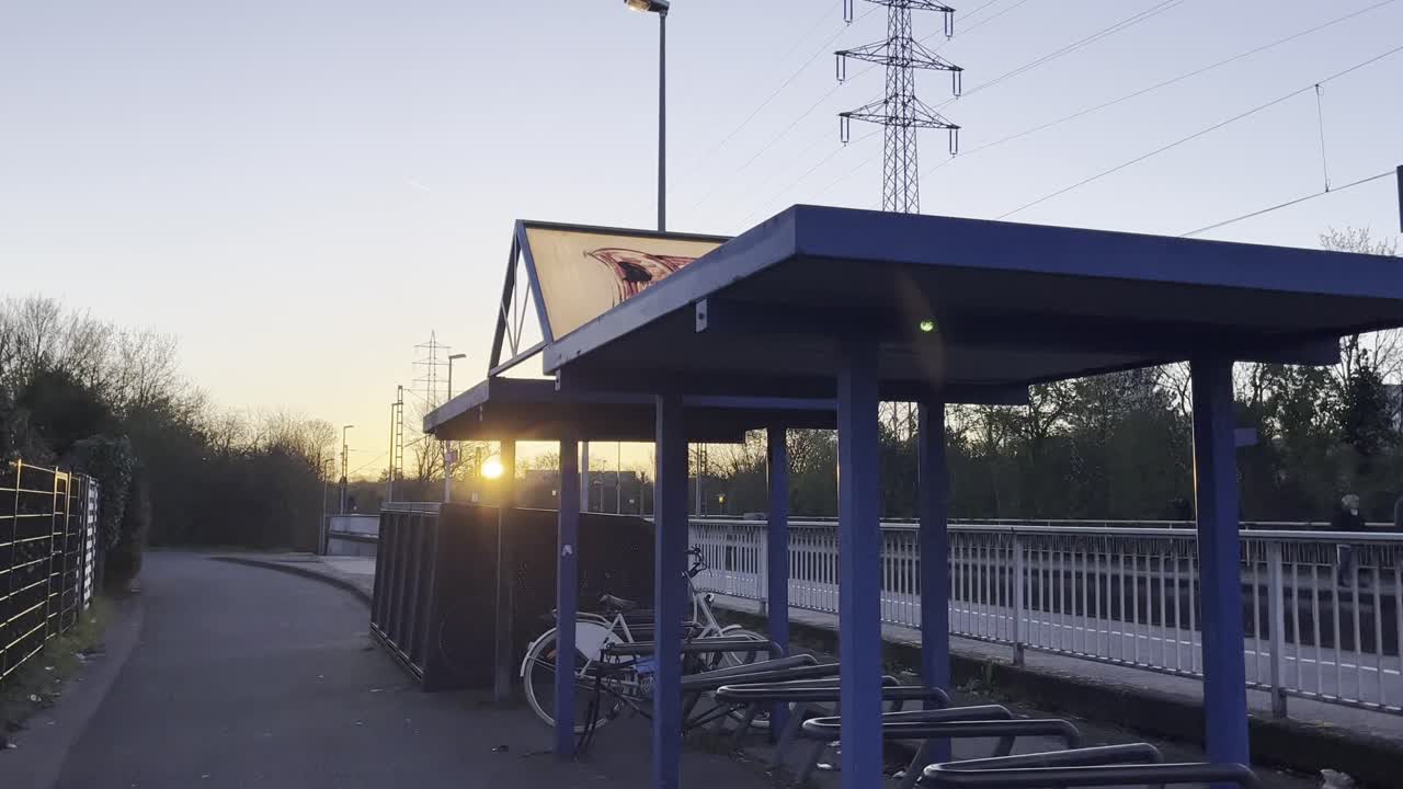 s bahn station with bike racks at sunset