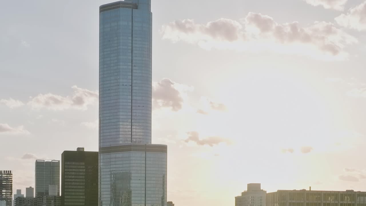 View of Chicago skyscrapers under sunny sky at dusk