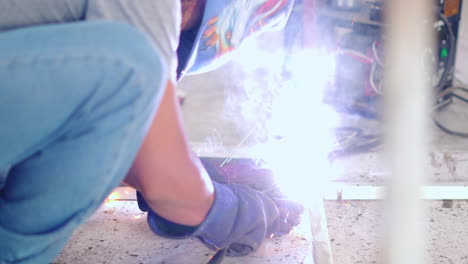 Close-Up-Of-A-Welder-Welding-Steel-Frame-In-A-Fabrication-Plant