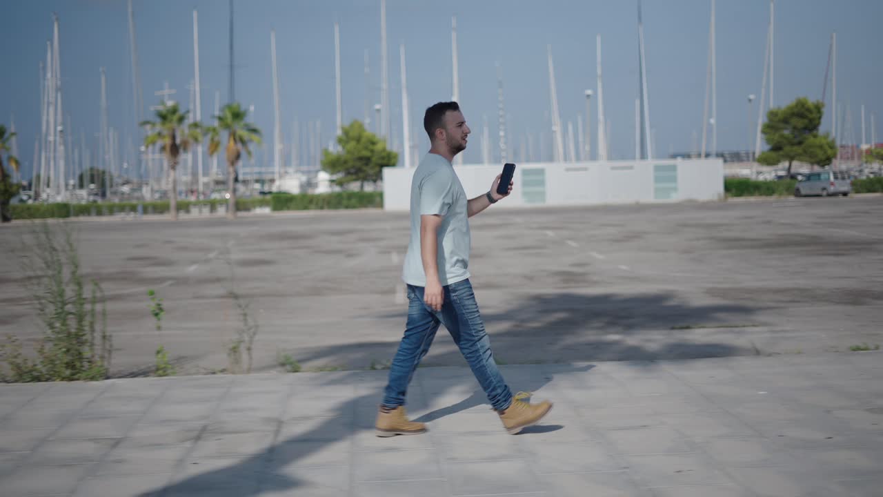 Man Walking With Smartphone