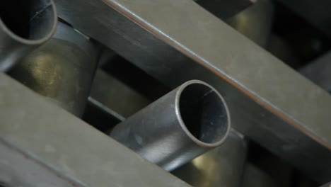 metal pipes used in the industry of various sizes and thicknesses are rotated and displayed.