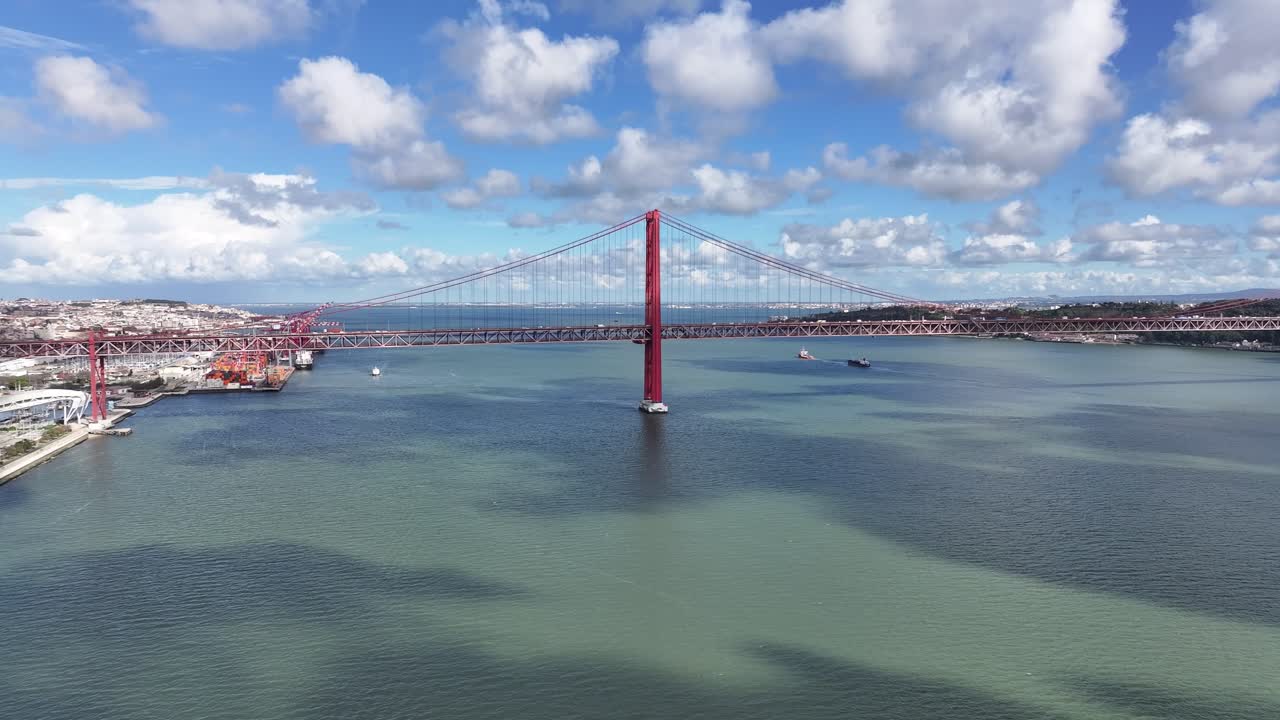 25Th April Bridge At Lisbon In Lisbon District Portugal. Megalopolis Downtown Cityscape. Vehicles Travel. 25Th April Bridge At Lisbon In Lisbon District Portugal. Cable Bridge Scenery.