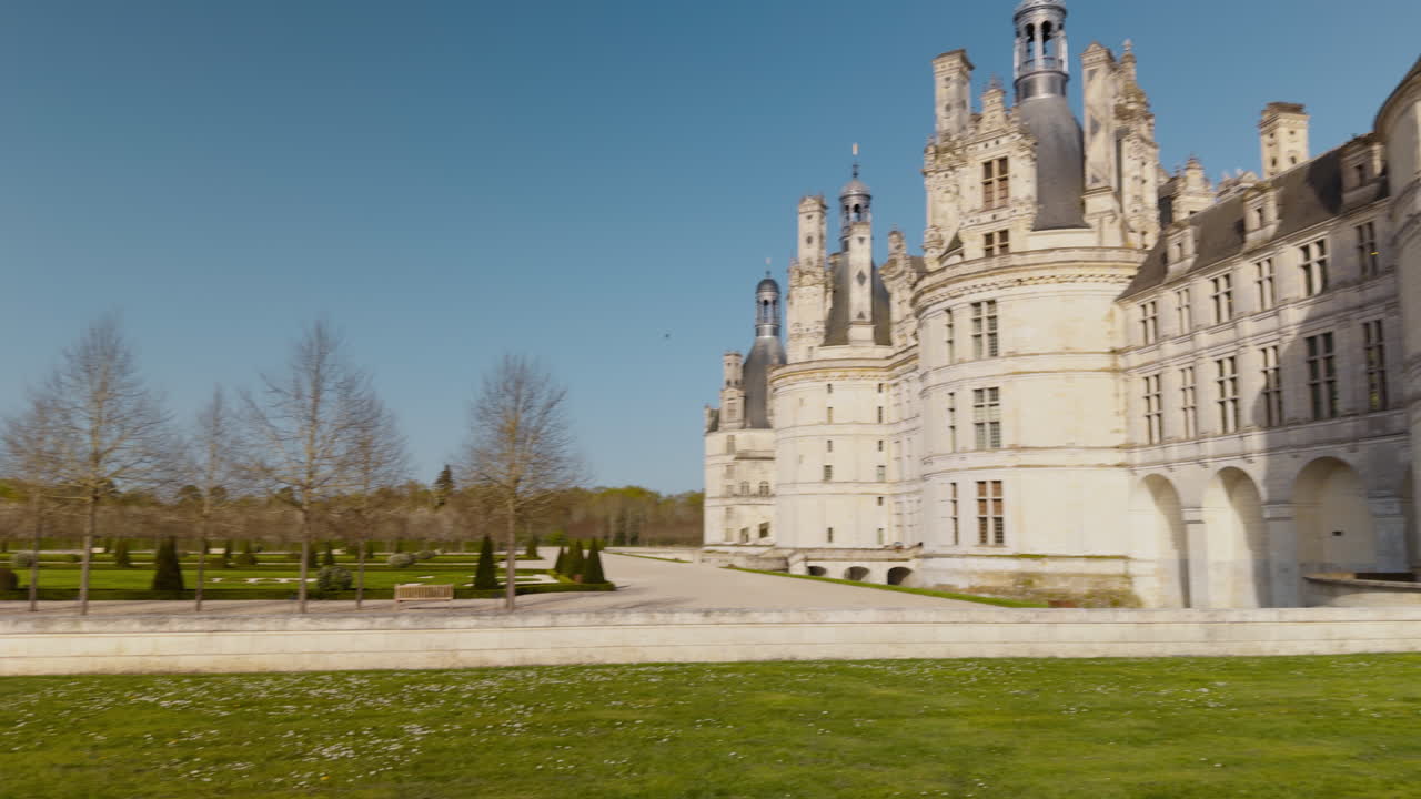 Majestic Renaissance castle under blue sky, designed by Da Vinci in Chambord, France