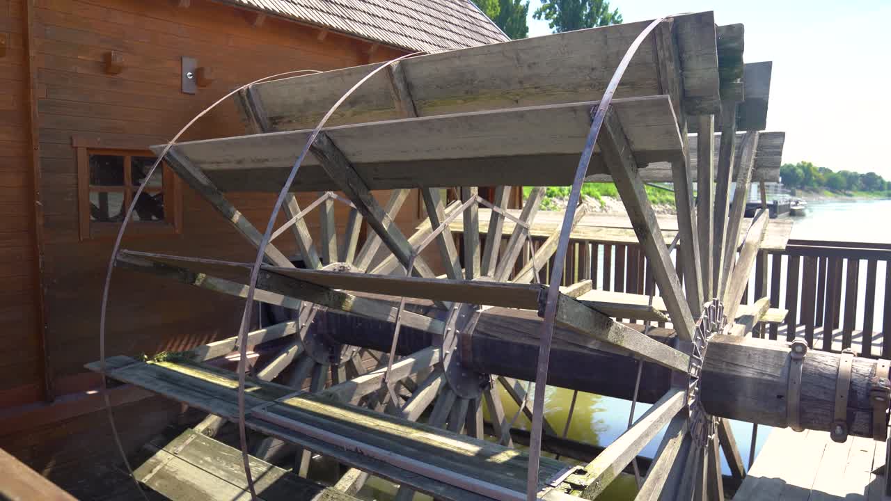 Close up of large waterwheel powering Ship Mill on Danube River, Baja, Hungary.