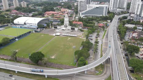 wide panning shot from an aerial drone of jam besar dataran in johor bahru, a famous landmark in malaysia