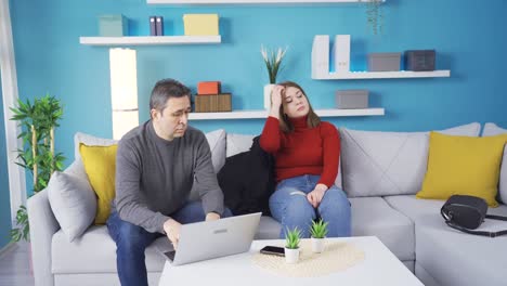 The-girl-comes-home-troubled-and-sits-down.-His-father-comforts-him.