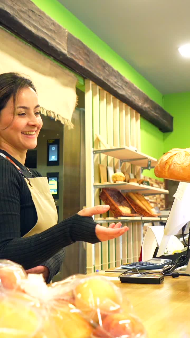 Woman in bakery serving a customer