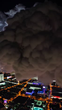 night cityscape with dramatic clouds