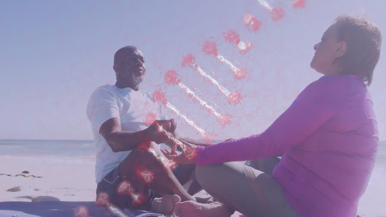 Two people meditating on beach with abstract red animation between them