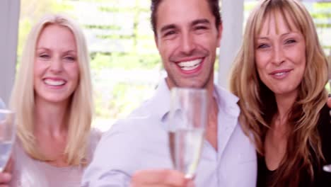 happy friends toasting with champagne