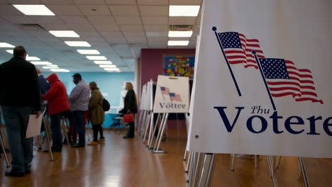people participating in an election at a polling place