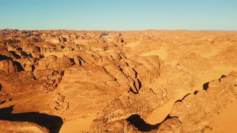 Rock-formation-in-desert-near-Al-Ula,-Saudi-Arabia-at-sunset