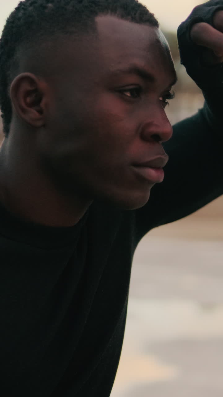 Close-up Profile of Thoughtful Young African American Man Looking Away