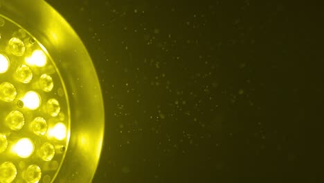 yellow light shining bright, revealing dust particles floating in the air.