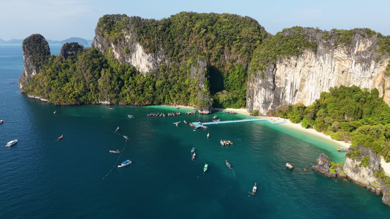 Aerial view of Hong Island's stunning cliffs and turquoise waters in Krabi, Thailand. This drone video captures vibrant scenery and pristine beaches from above