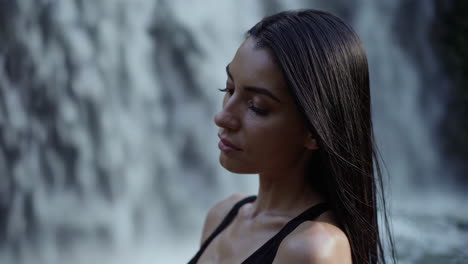 woman by waterfall
