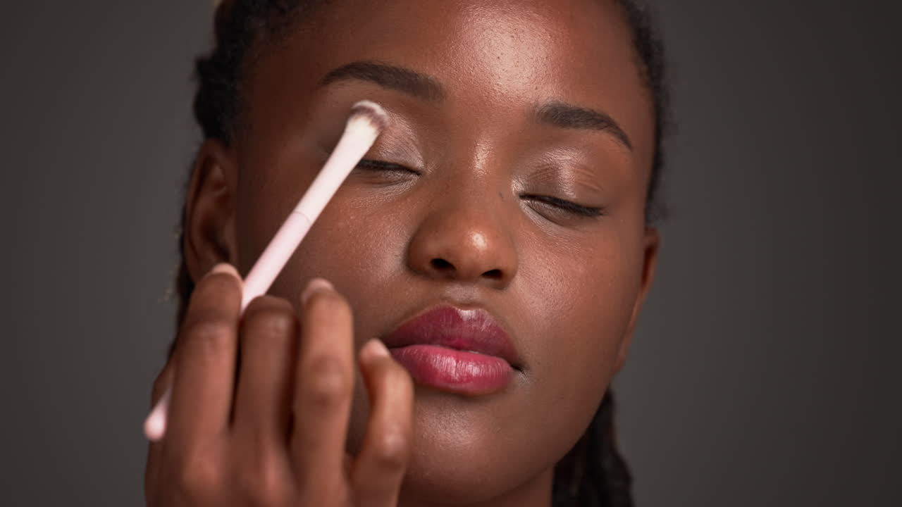 Woman applying eye shadow