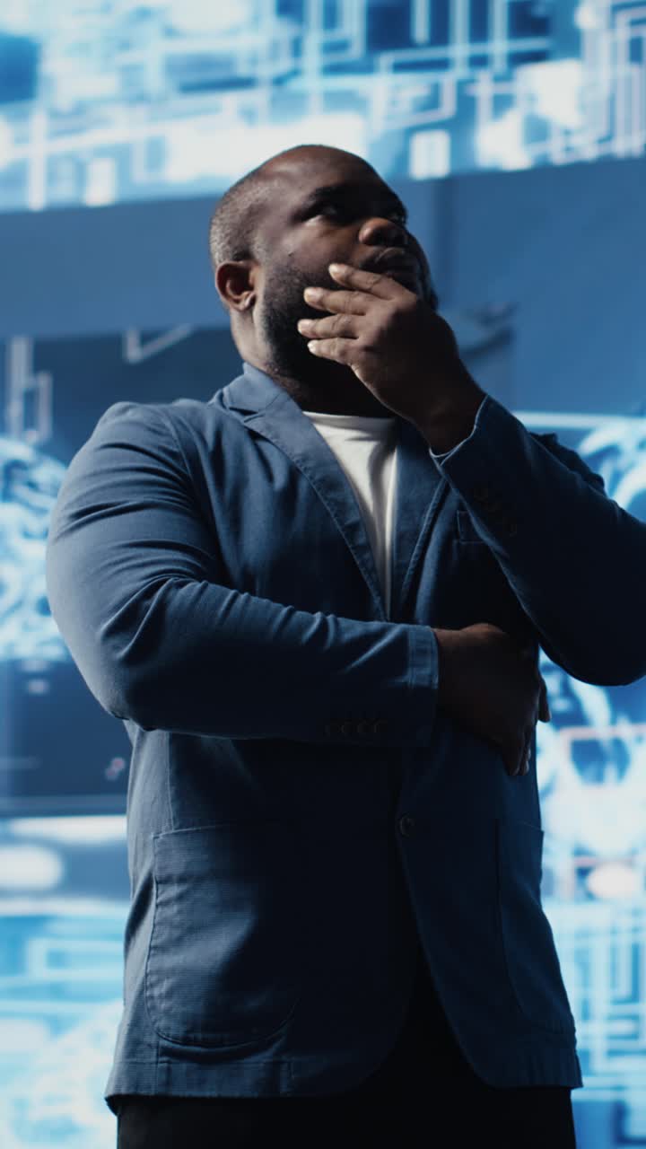 Thoughtful Man Contemplating in Front of Futuristic Digital Screen