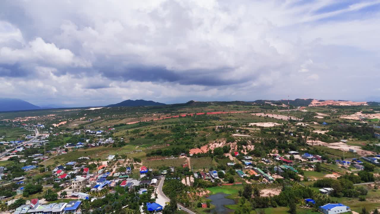 Aerial View Pan of the city near the coast in Binh Thuan (Vietnam) during the rainy season