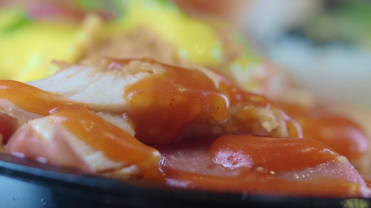 Close-up of chicken or meat covered in sauce