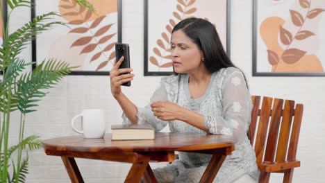 Upset-Indian-mother-talking-on-video-call