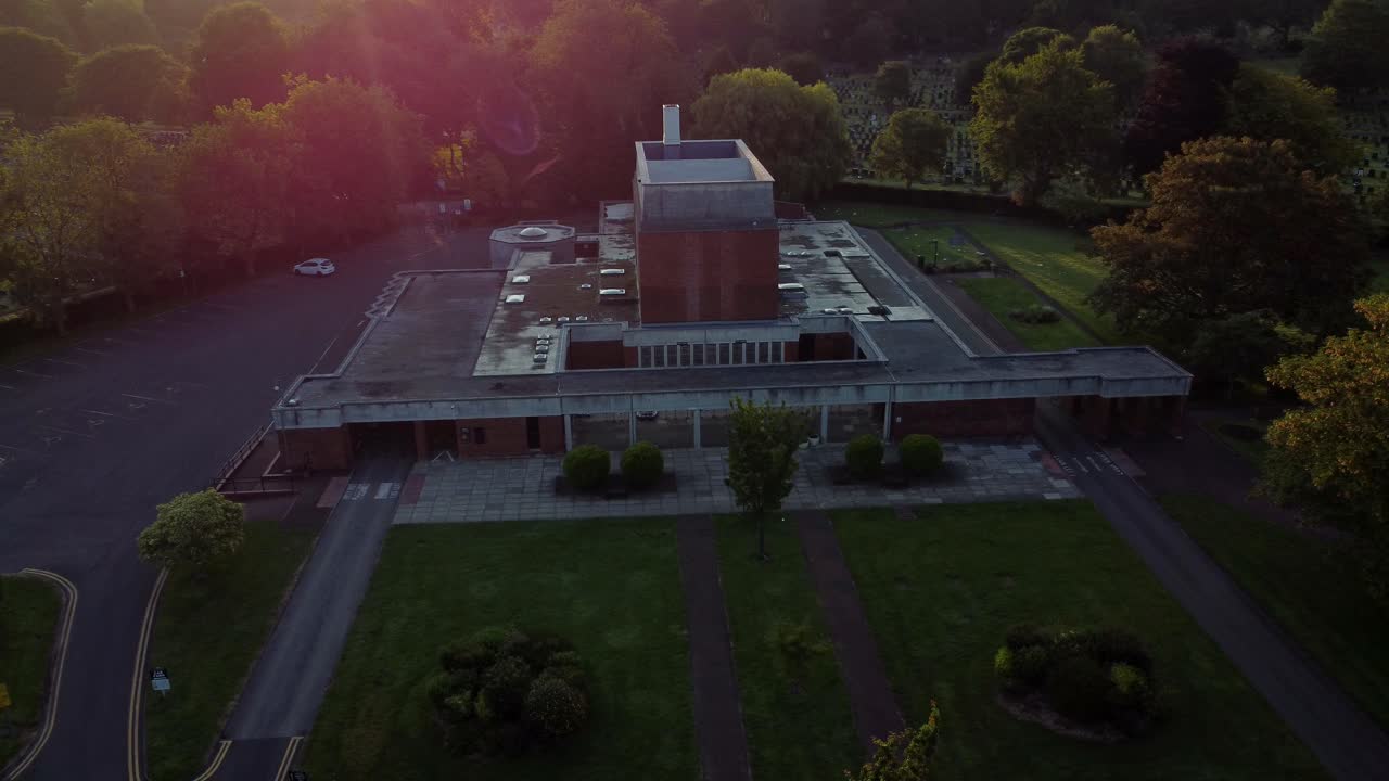 St Helens crematorium facility aerial view establishing golden hour sunrise family cemetery gardens