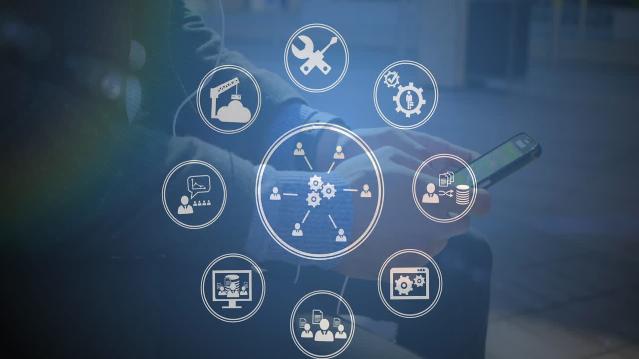 Animation of icons over caucasian businessman using smartphone at office