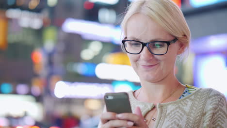 Woman-Uses-A-Smartphone-at-Night