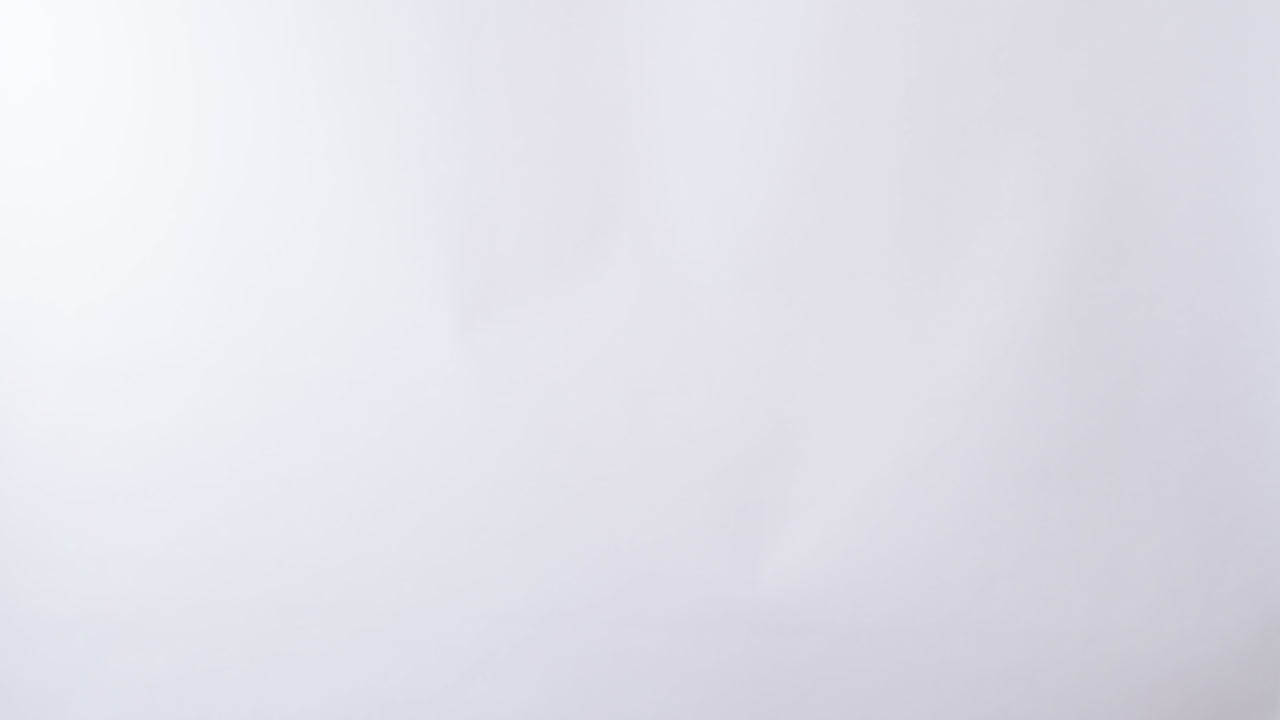 Woman's hand shows the paper on board with the word I LOVE YOU in white studio background with copy space.