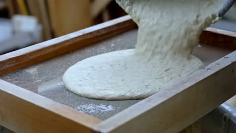Traditional Papermaking Process with Pulp on a Screen