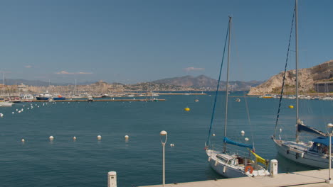 locked off shot of sailboats moored in the picturesque harbor of the frioul archipelago, france